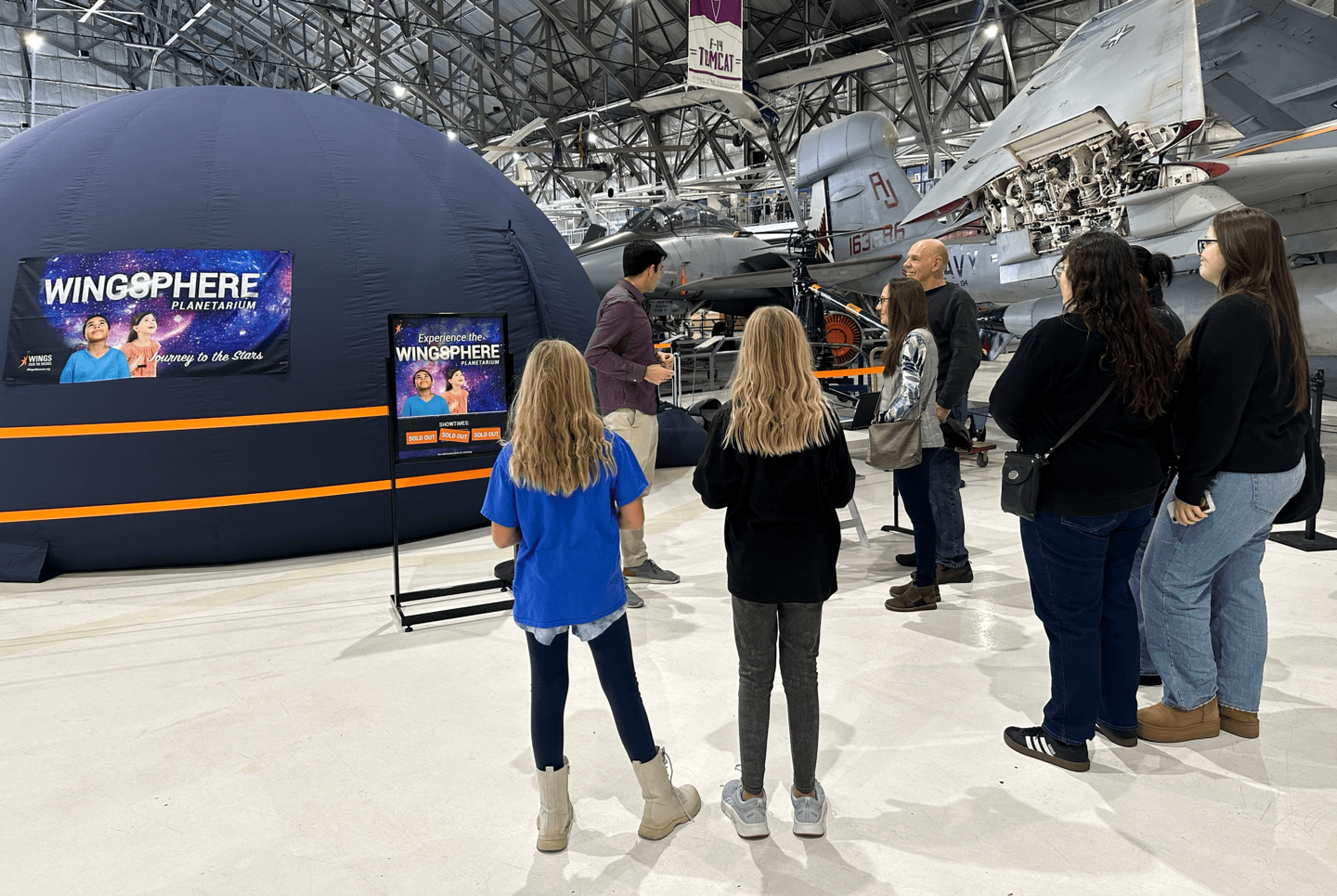 A group outside of the Wingsphere Planetarium