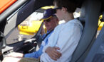 Students sitting in aircraft and listening to pilot