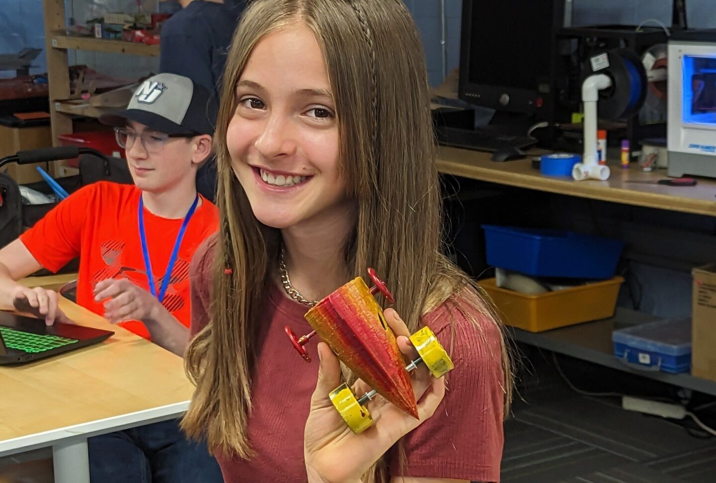 Wings Aerospace Exploration student smiling with model project