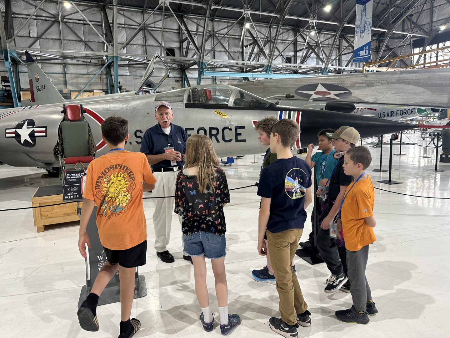 Volunteer giving a tour to students