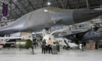 Guests standing under the B-1A Lancer at the Air & Space Museum