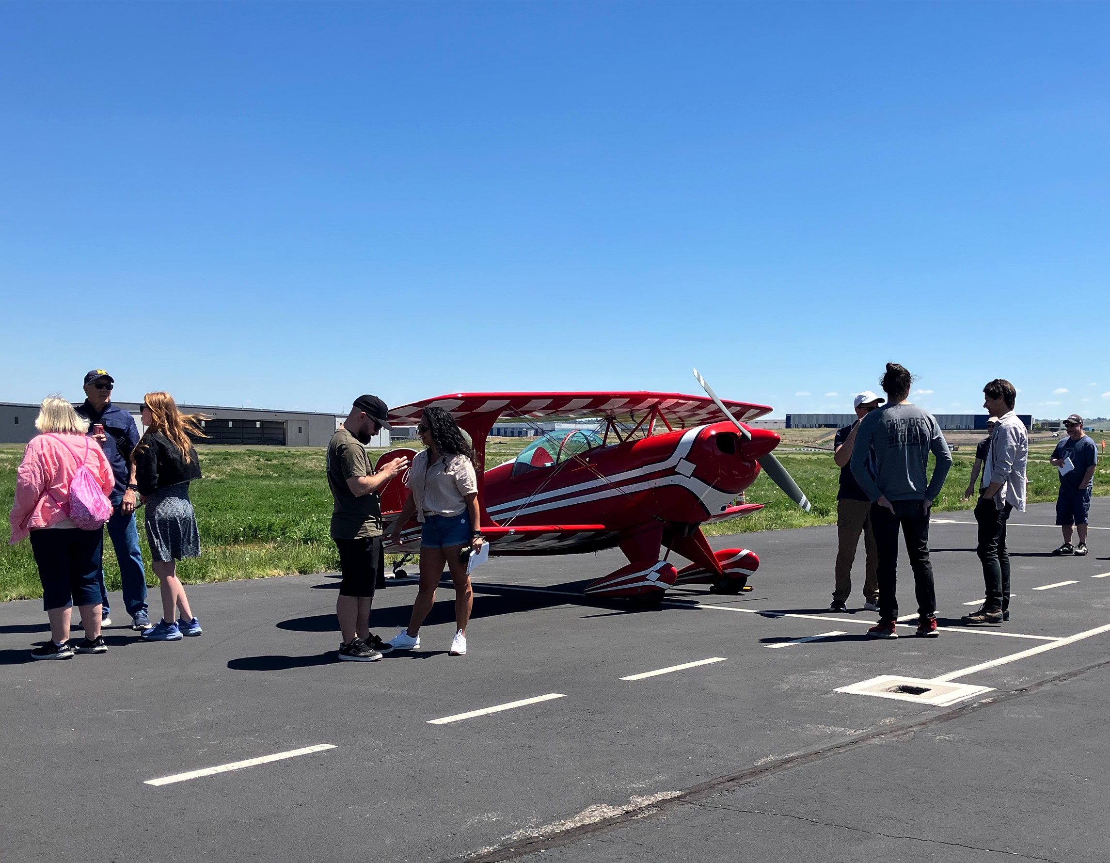 Guests checking out an aircraft on the ramp at Exploration of Flight