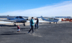 Family checking out airplanes on the ramp at Exploration of Flight