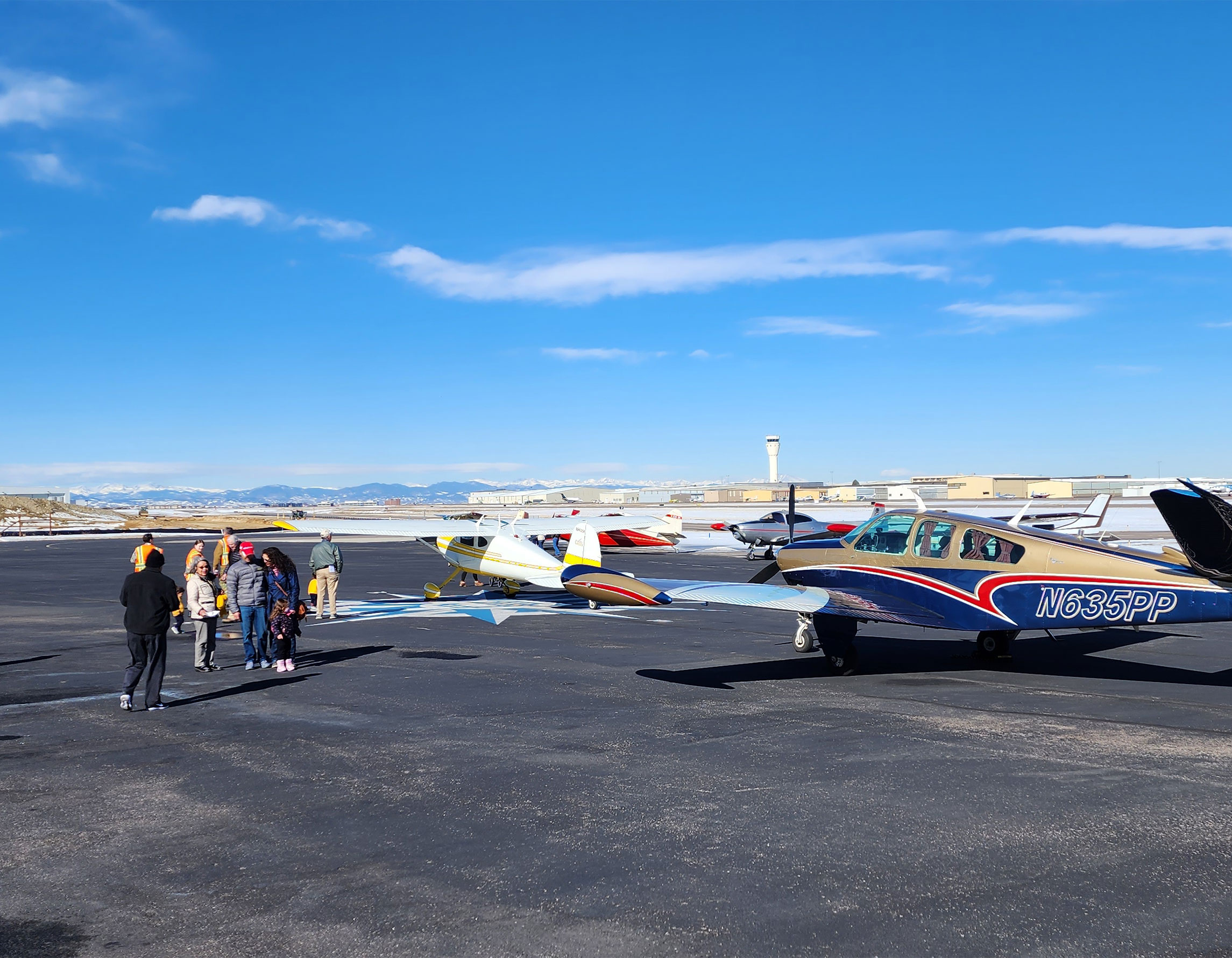 Guests on the ramp at Exploration of Flight surrounded by aircraft