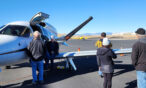 Guests at Exploration of Flight checking out an airplane on the ramp