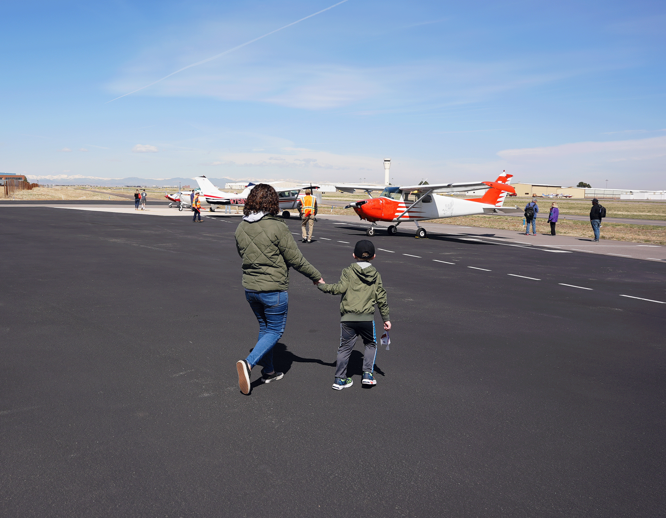 Mother & son looking at aircraft on the flight ramp at Exploration of Flight