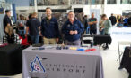 Booth with exhibitors at the Aviation Career Symposium