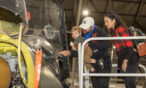 A family looking into the cockpit of aircraft at the Air & Space Museum