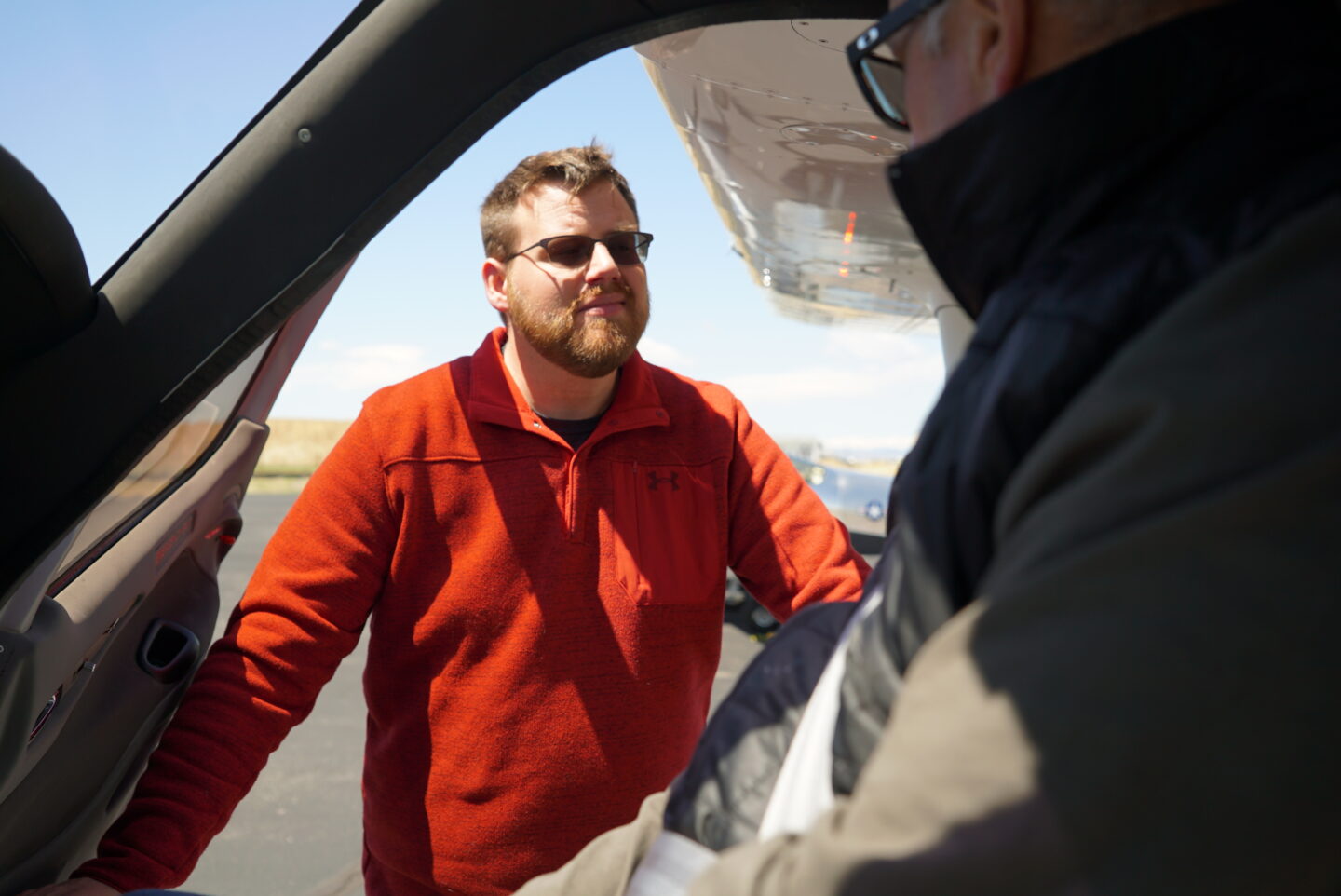 Jordan Ashley preparing a guest for a flight experience