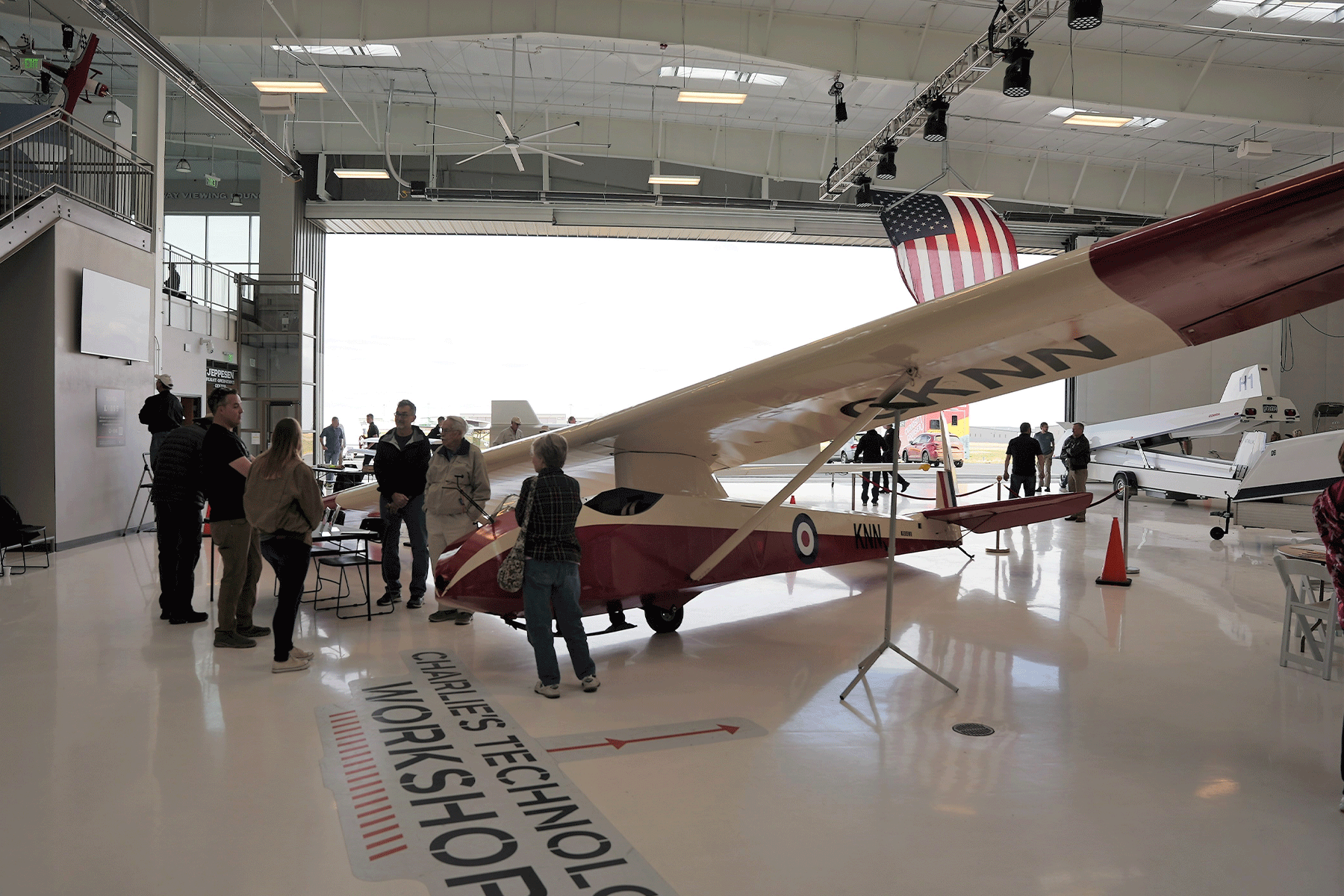 Guests looking at a Glider in the hangar at Exploration of Flight