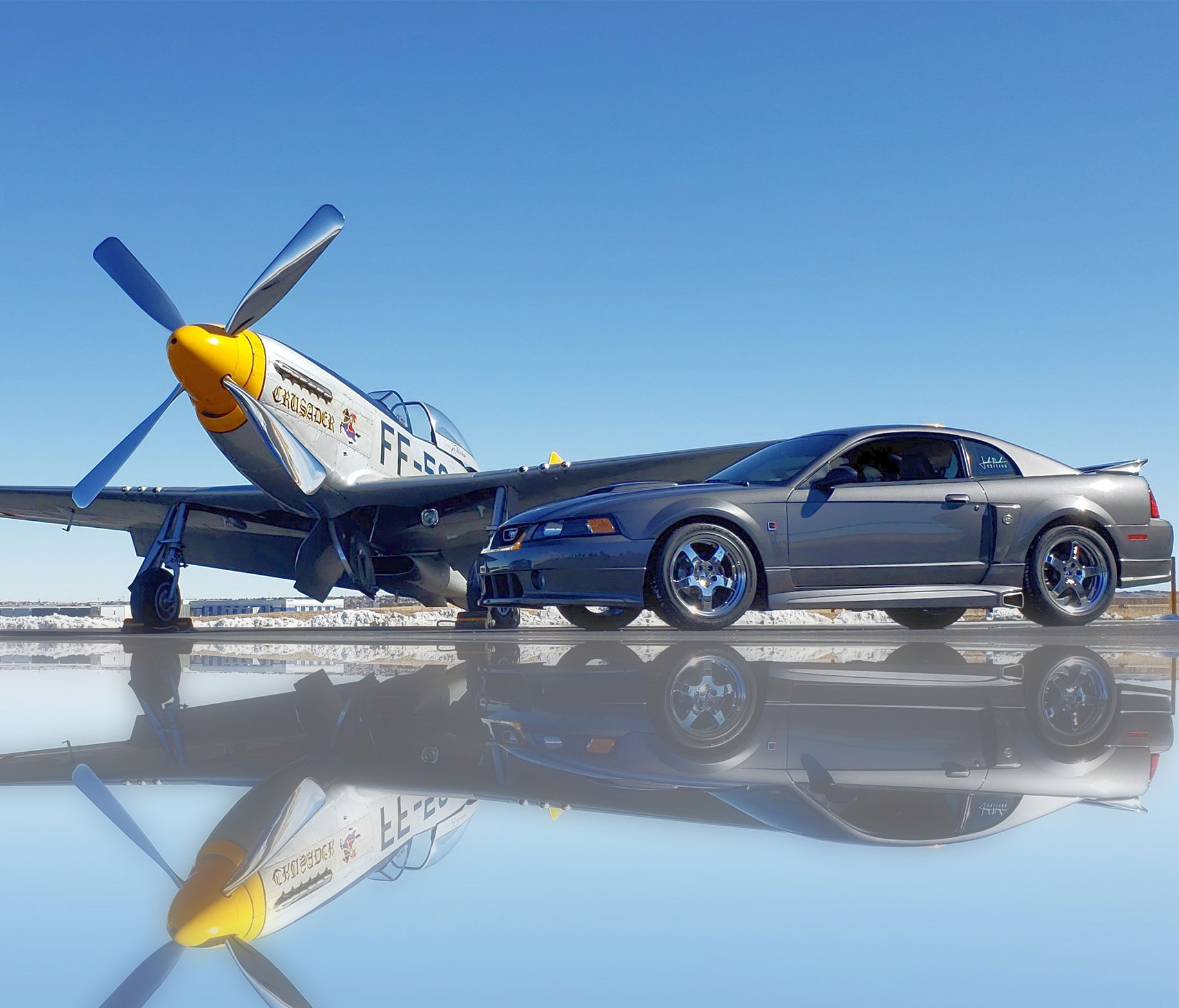 Aircraft and Mustang car on the ramp