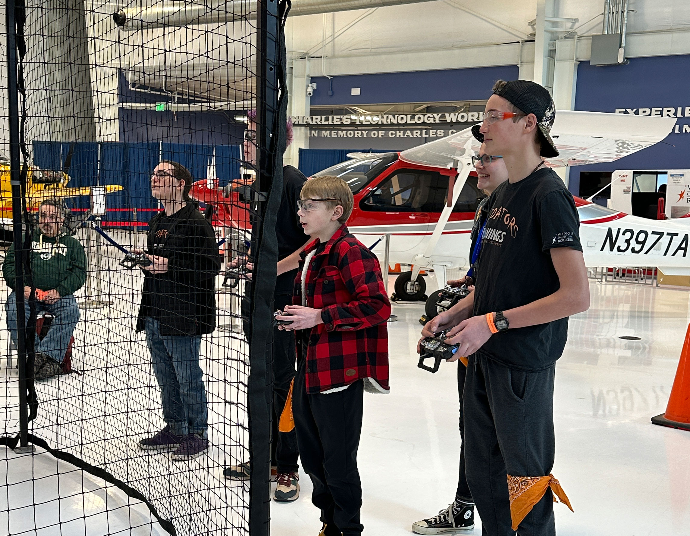 Students playing drone soccer