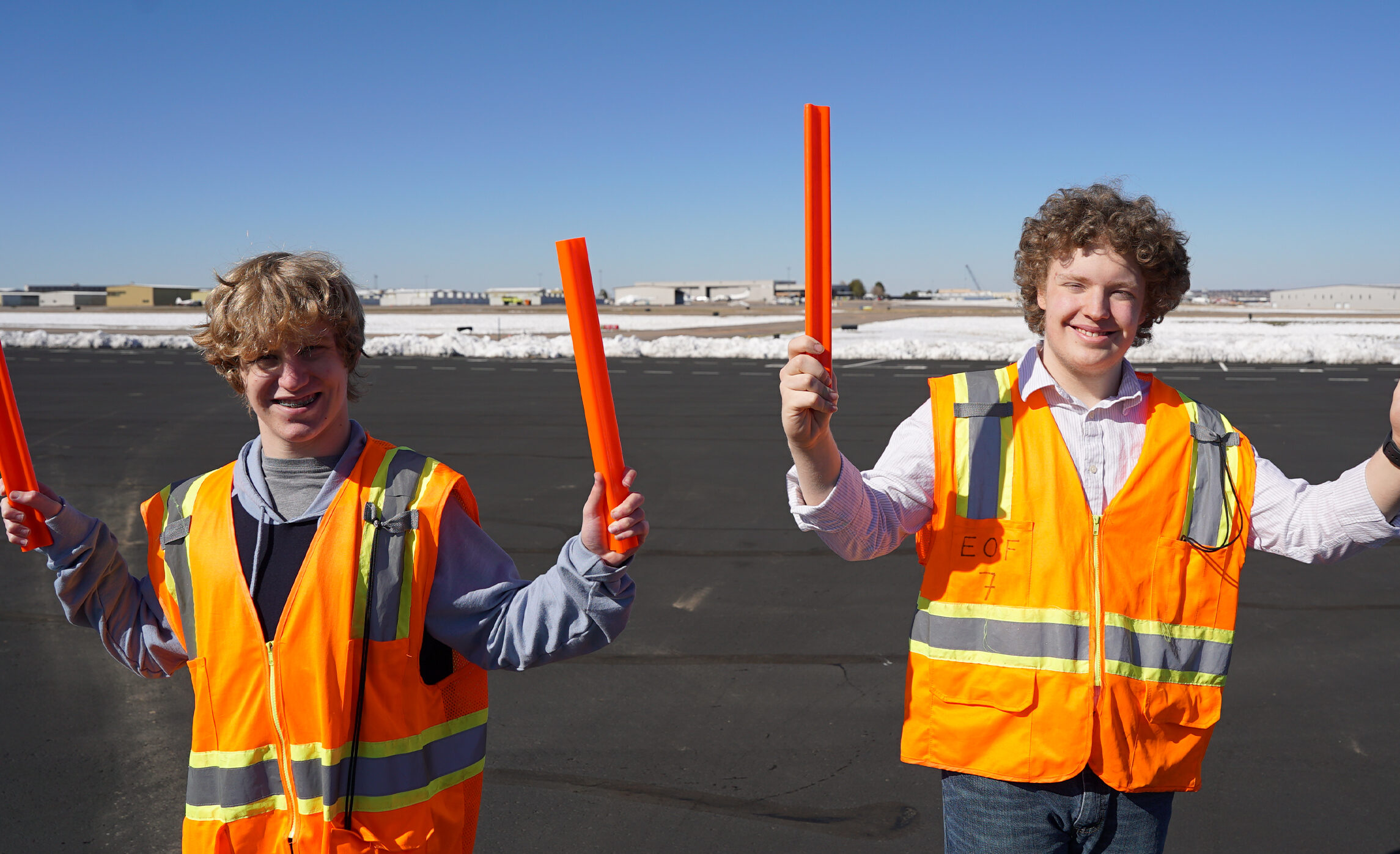 Wings Aerospace Exploration students learning about flight marshalling on the ramp at Exploration of Flight