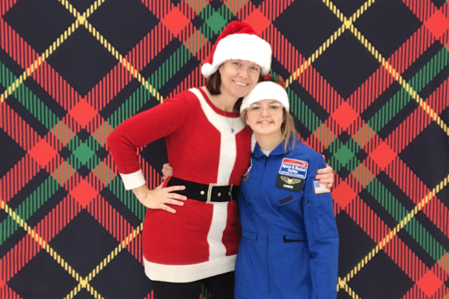 Holiday photo booth of woman and girl smiling