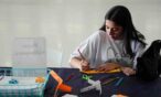 Girl doing hands-on activity during Sensory Friendly Hours