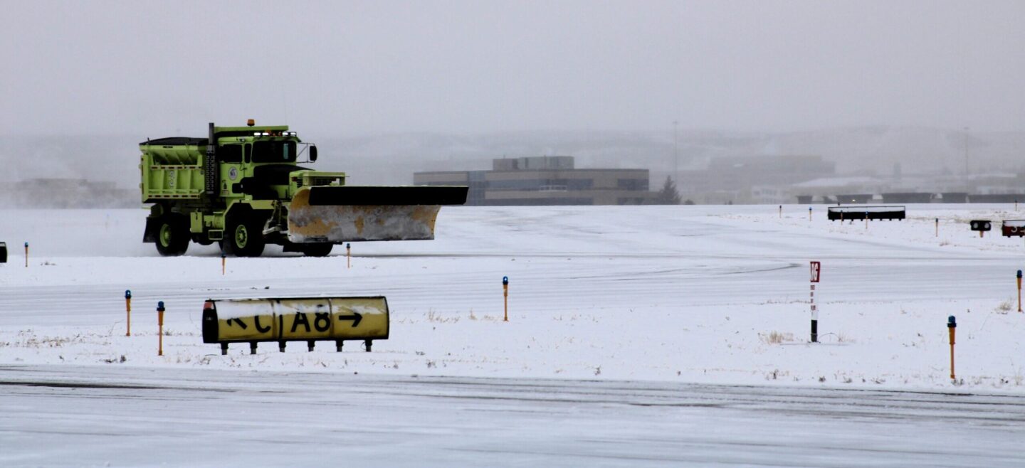 Snow plow clearing runways