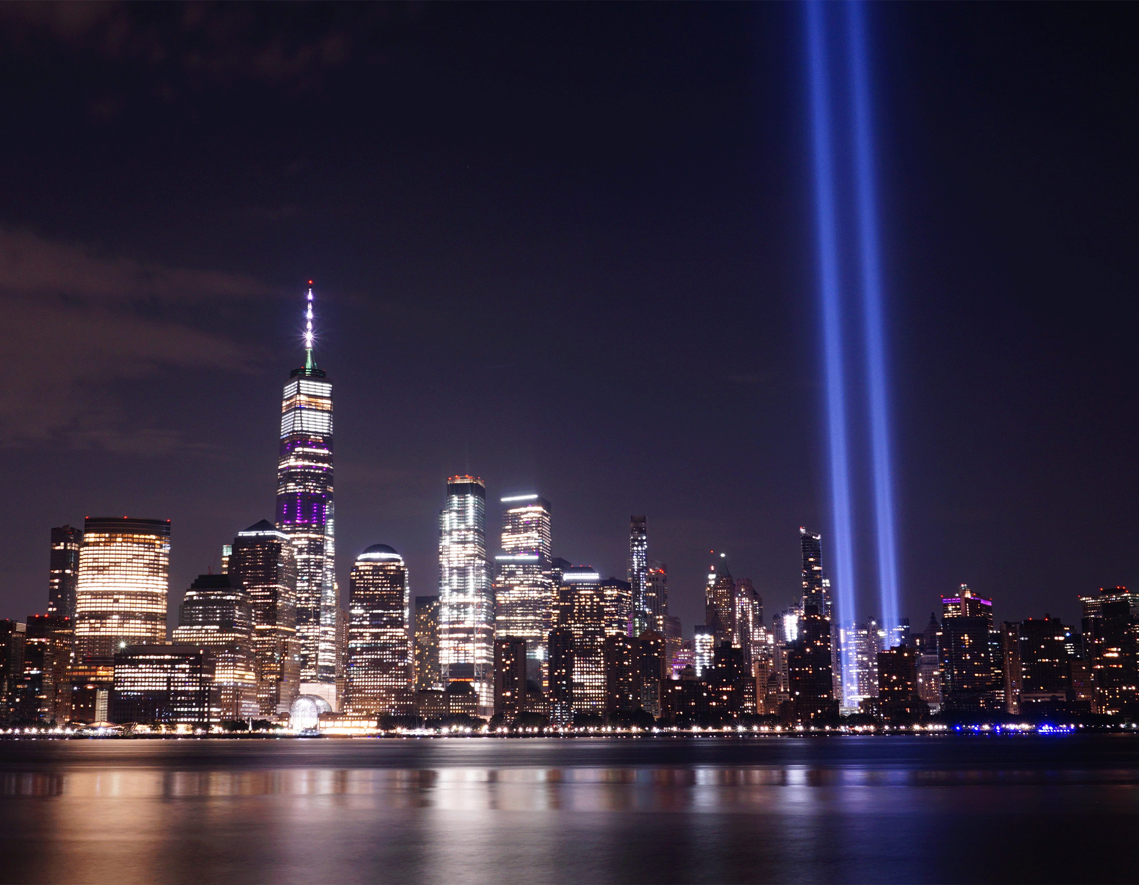Skyline of New York City with light tributes to 9/11