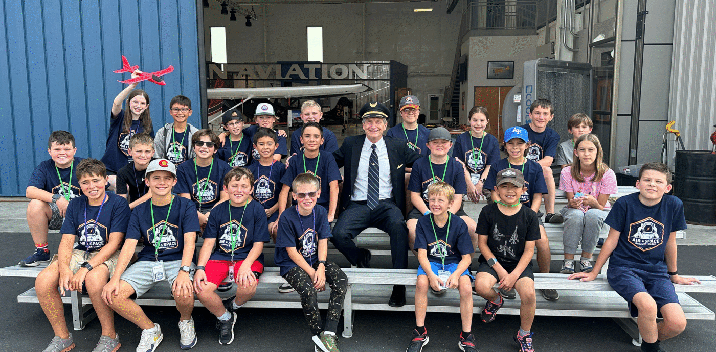 Campers smiling with a commercial pilot