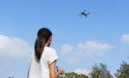 Girl flies drone