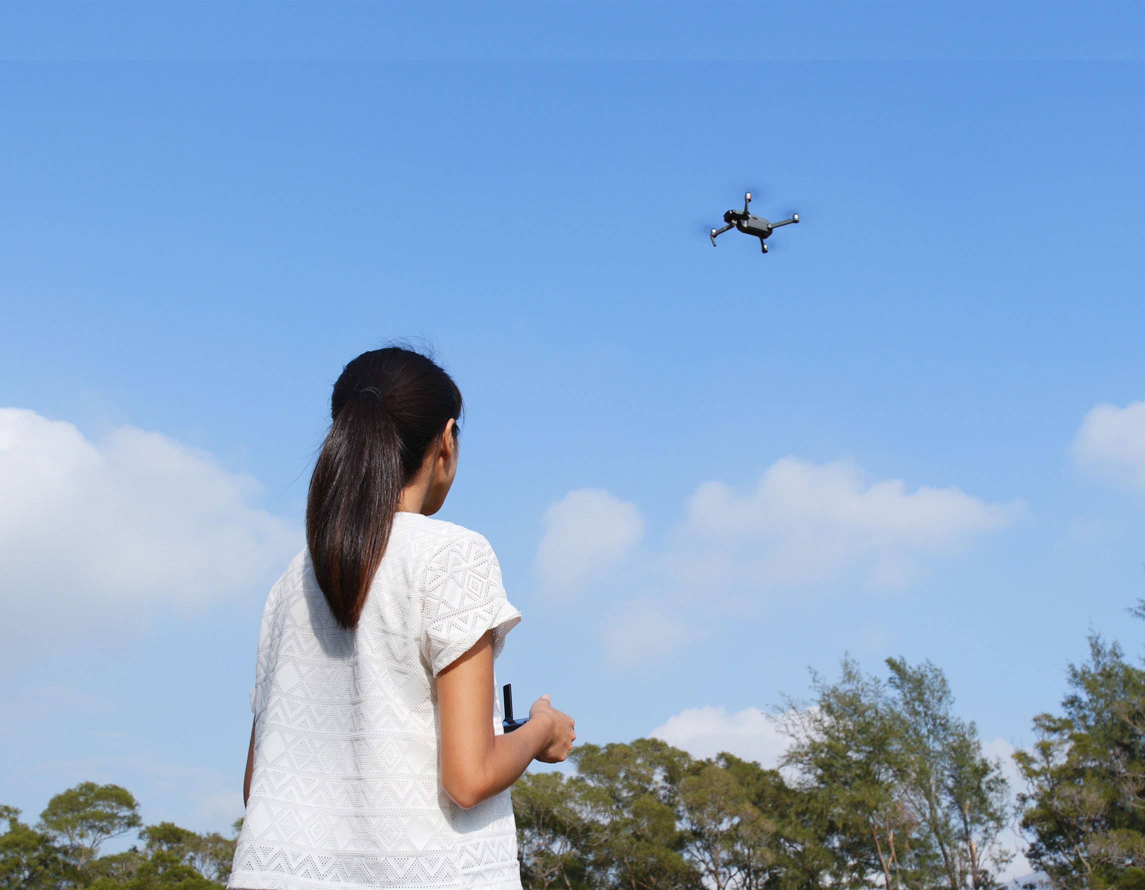 Girl flies drone