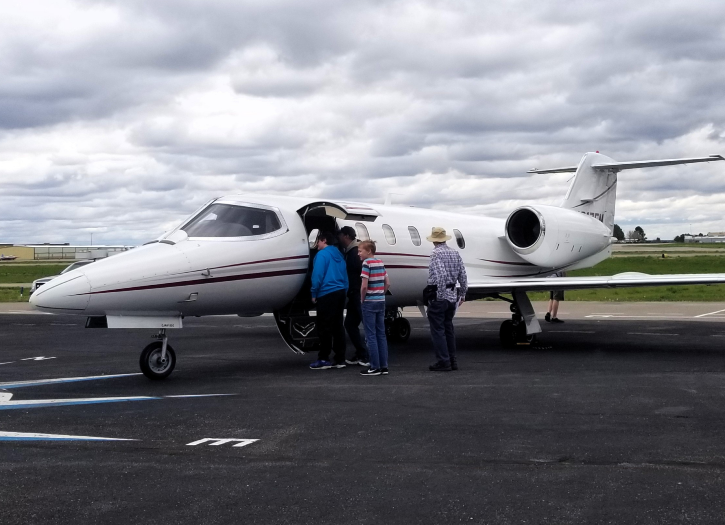 Guests looking inside of a jet on the ramp at Exploration of Flight
