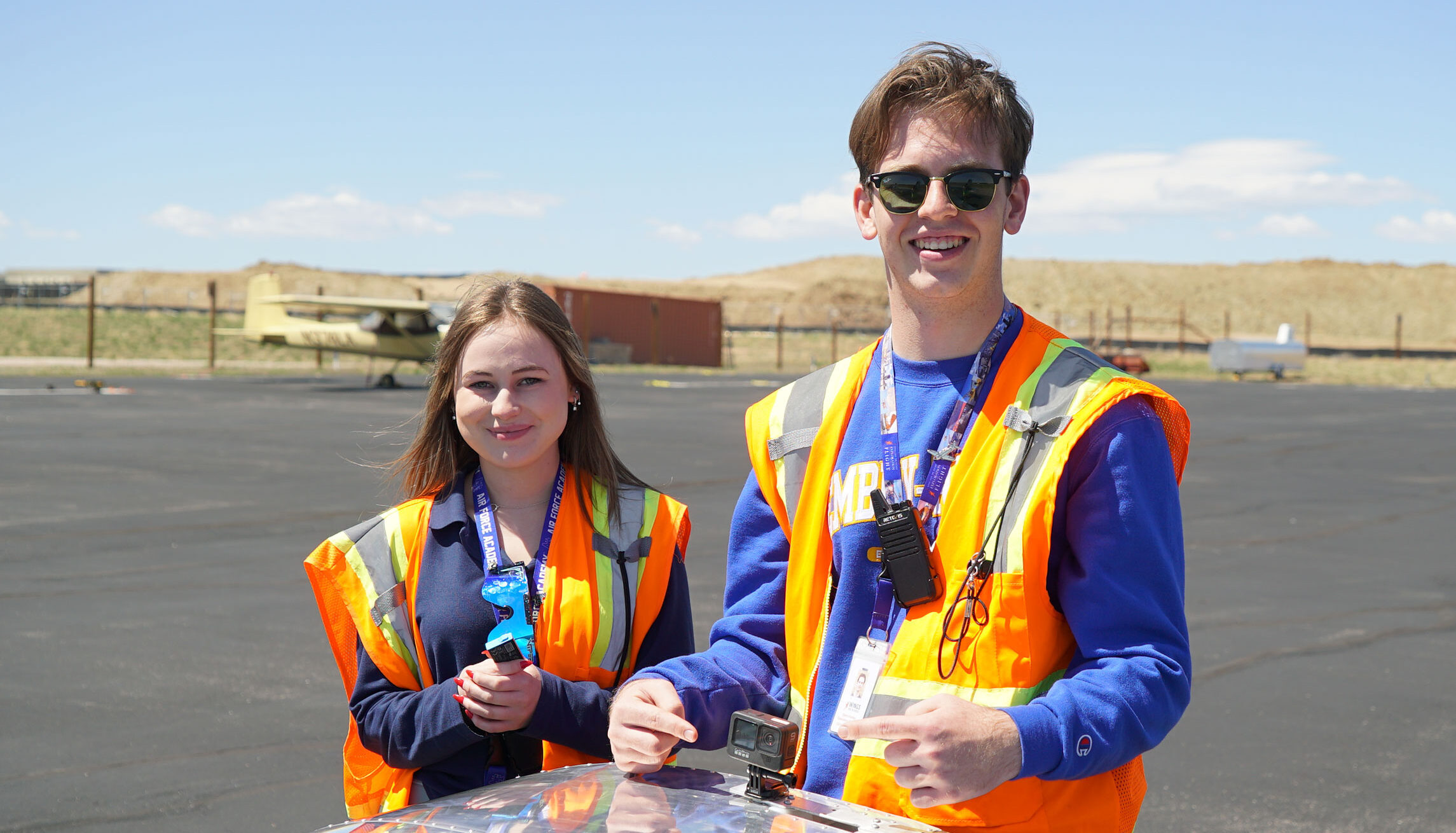 Students smiling on the ramp at Exploration of Flight