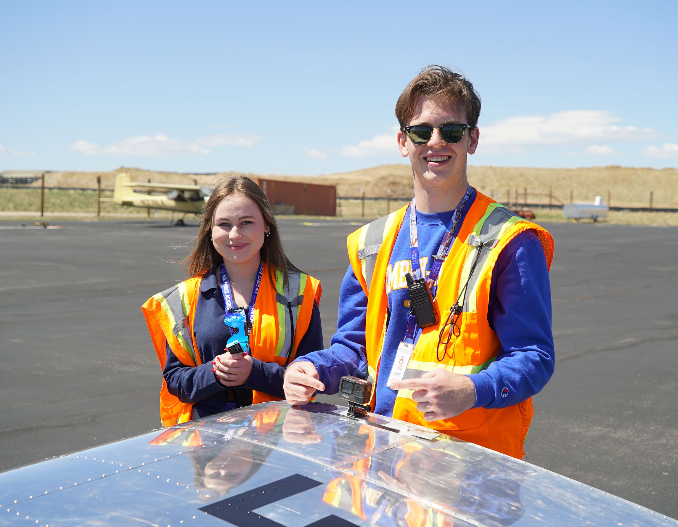Students smiling on the ramp at Exploration of Flight