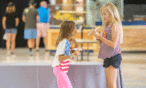 Two girls playing with balsa planes