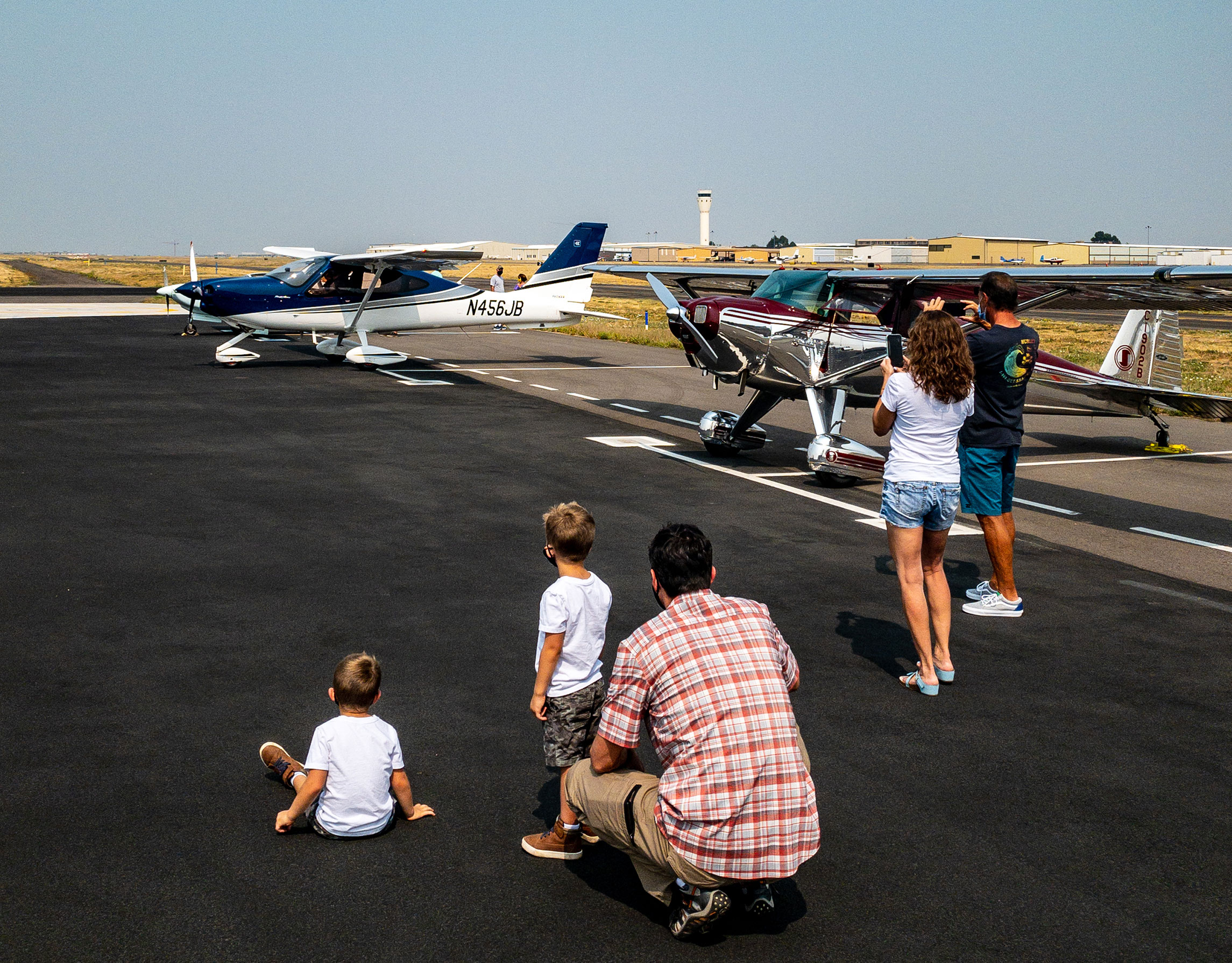 People viewing aircraft up close on the ramp