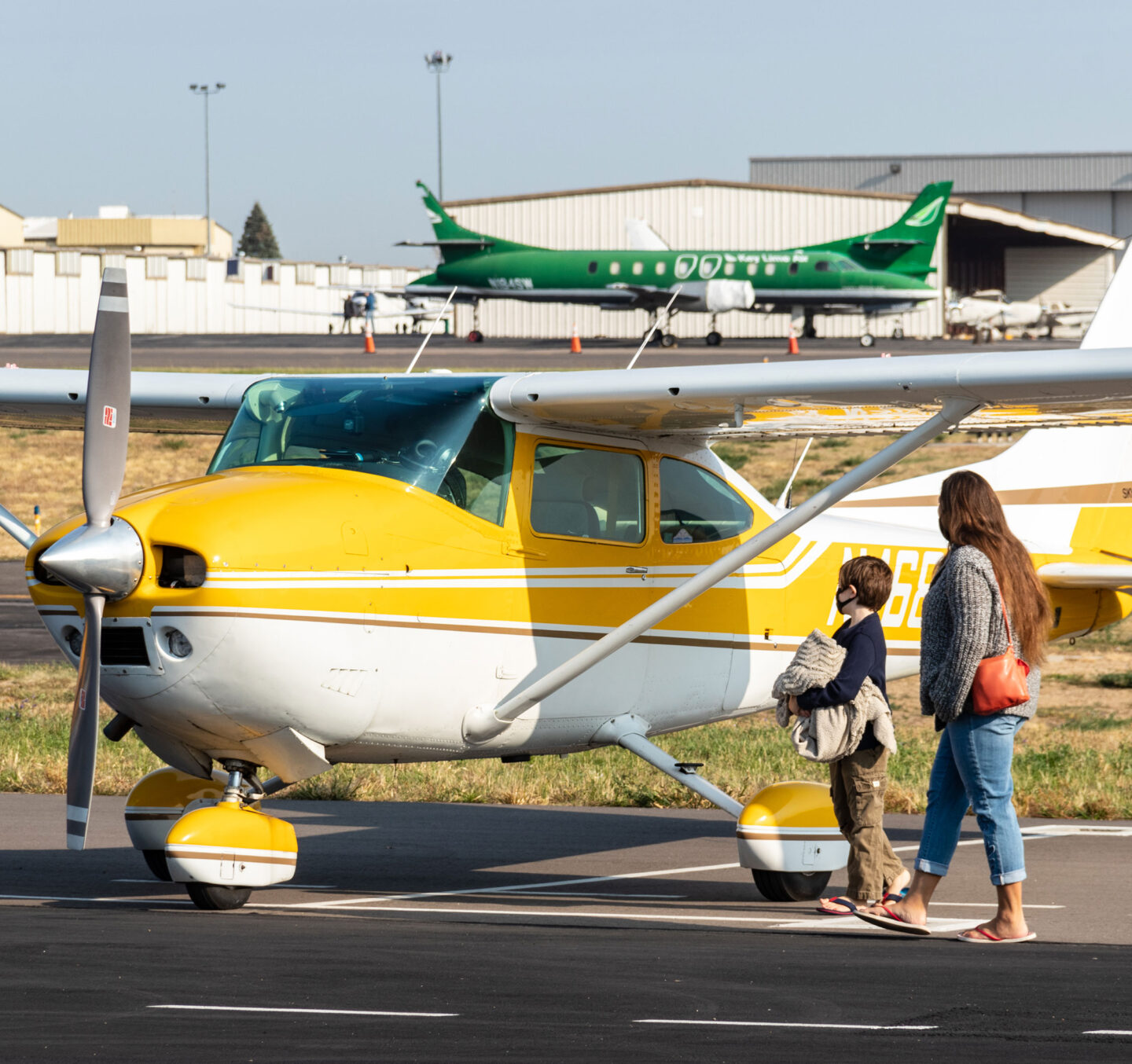People view aircraft up close on the ramp