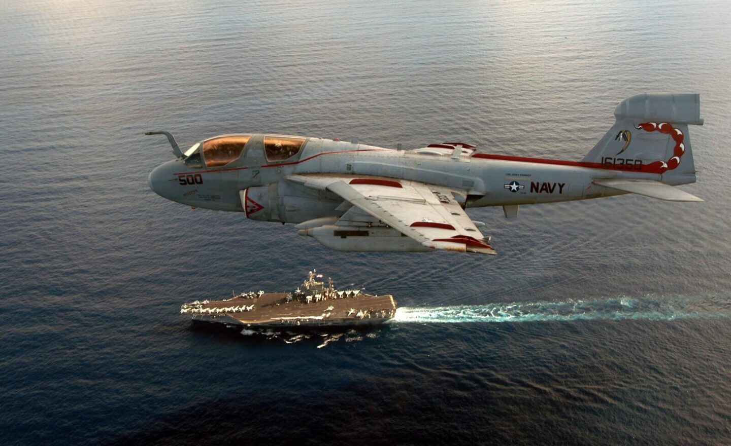 EA-6B Prowler flying over an aircraft carrier