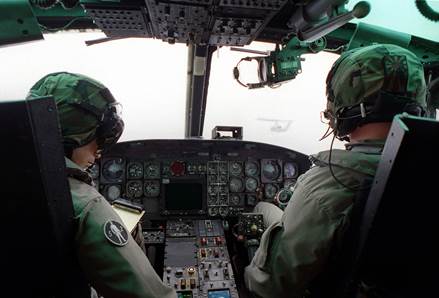 Two instuctors pilots low flying huey helicopter